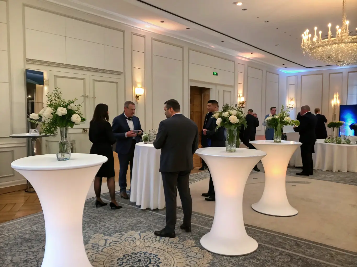 A sophisticated corporate event setup with professional decorations, branded materials, and networking opportunities, demonstrating Kitty's Party's capability in organizing successful corporate gatherings.